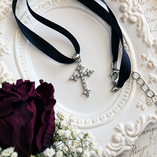 Satin choker accessory for styling a necklace.